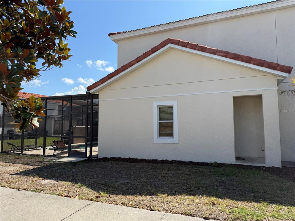 4573 Ada Lane Kissimmee, FL 34746 - Photo 2 of 37 a view of a house with a yard