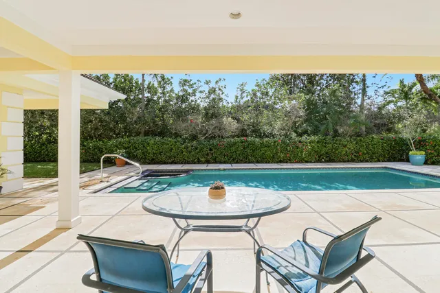 a view of a swimming pool with a patio