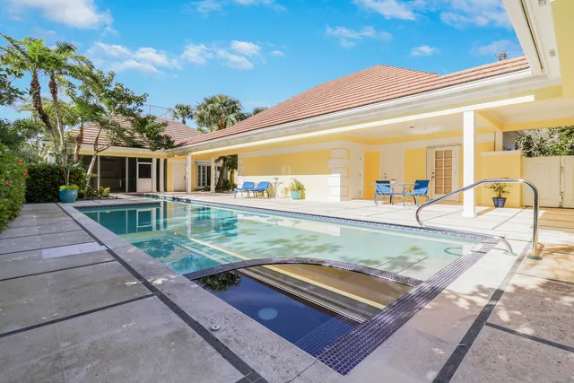 swimming pool view with a outdoor seating