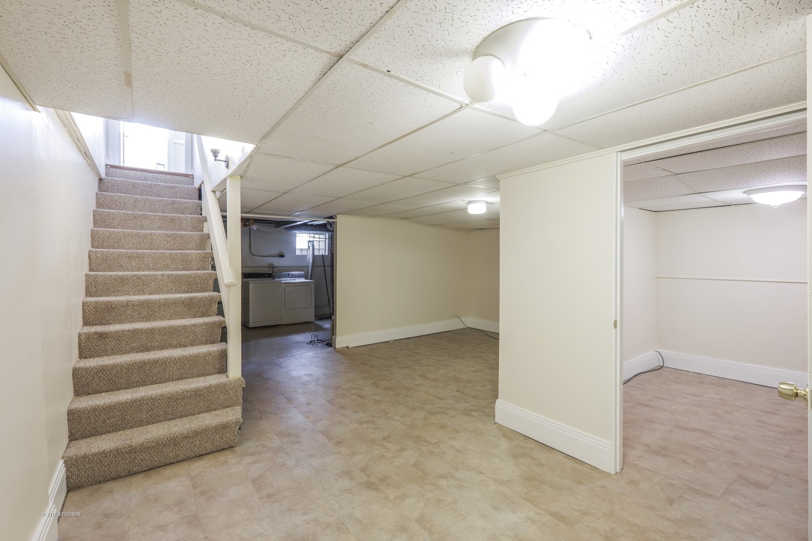 314 Skokie Road Wilmette, IL 60091 - Photo 8 of 14 a view of an empty room with stairs and a ceiling fan