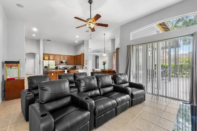 a living room with furniture and kitchen view