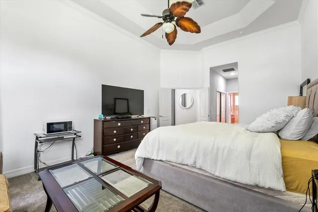 a spacious bathroom with a tub sink and mirror