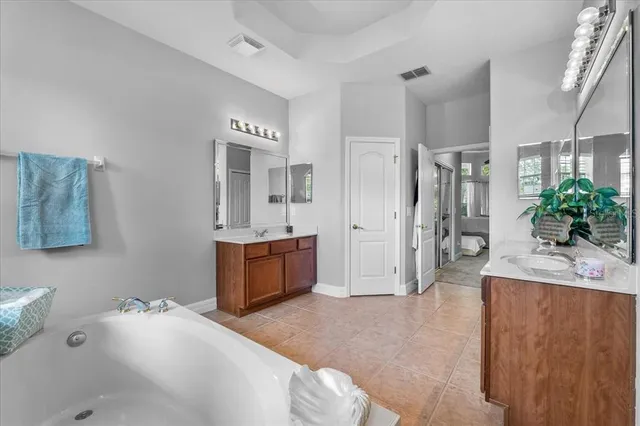 a bathroom with a bathtub and shower