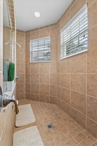 a bathroom with a toilet a sink and a window