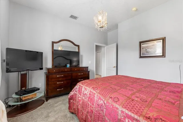 a bathroom with a sink a toilet and shower curtain