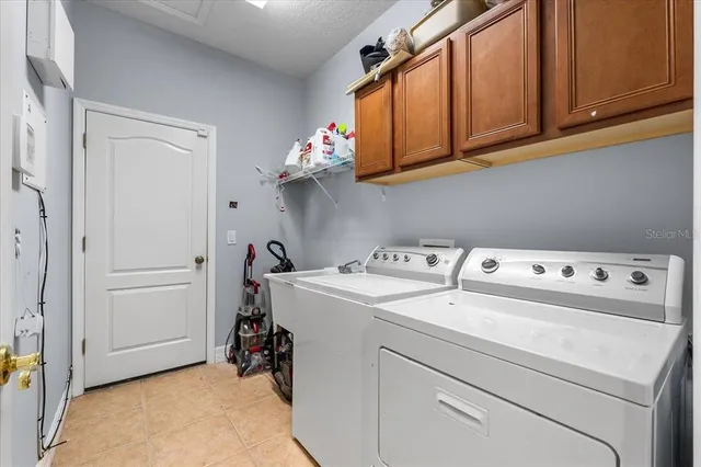 a view of the house with chairs and table in front of house