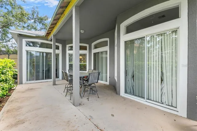 a front view of a house with a garden and plants