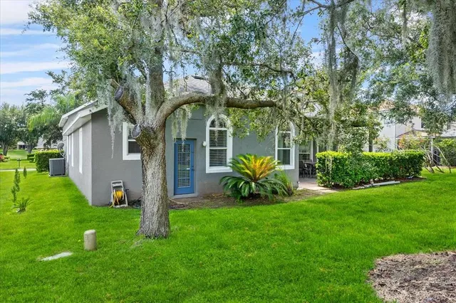 an aerial view of a house with garden space and street view