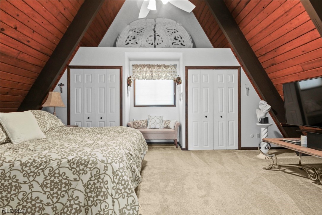 7550 South Raccoon Road Canfield, OH 44406 - Photo 12 of 32 Bedroom featuring light colored carpet, ceiling fan, wooden ceiling, and vaulted ceiling