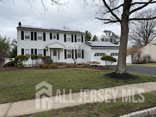48 Eastern Drive Kendall Park, NJ 08824 - Photo 2 of 9 a front view of a house with garden