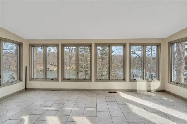 a view of an empty room with closet area