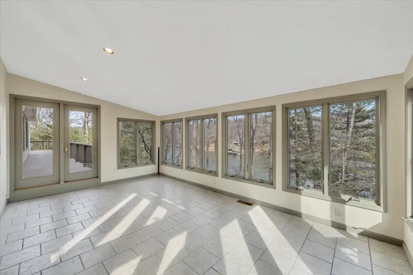 a view of an empty room with a fireplace