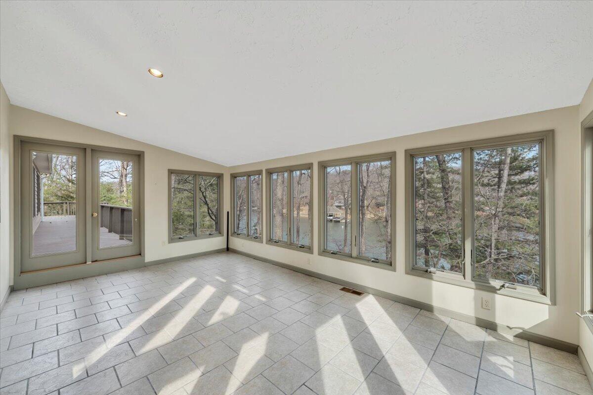 2768 Lake Retreat Road Huddleston, VA 24104 - Photo 26 of 92 a view of an empty room with wooden floor and a window