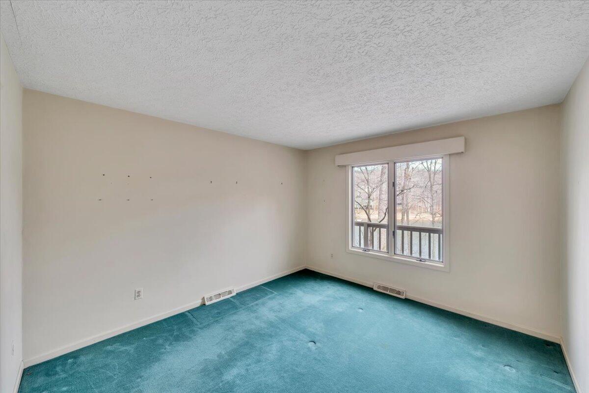 2768 Lake Retreat Road Huddleston, VA 24104 - Photo 31 of 92 an empty room with windows