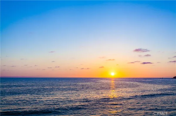 a view of a swimming pool with a lounge chair