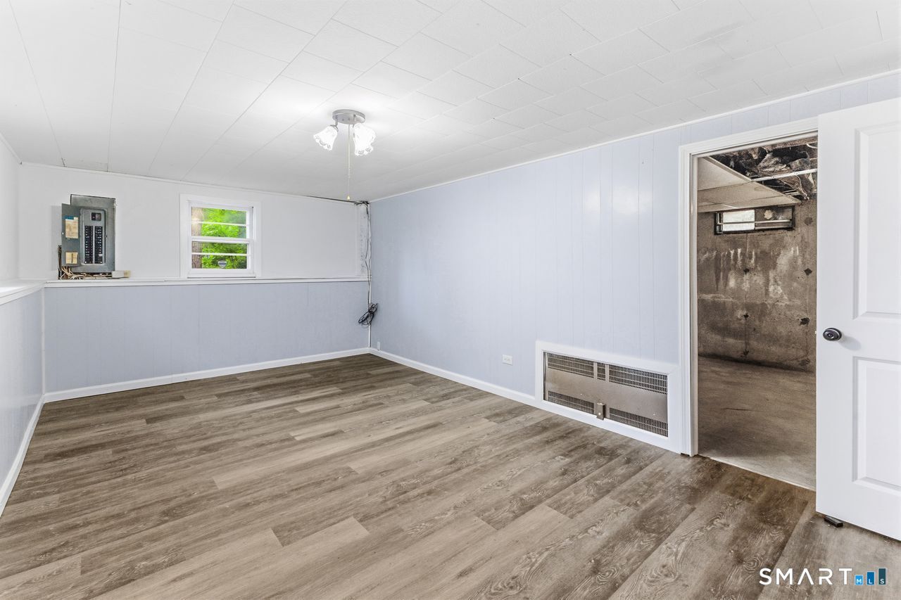 17 Rhoda Lane Bristol, CT 06010 - Photo 19 of 22 wooden floor in an empty room with a window