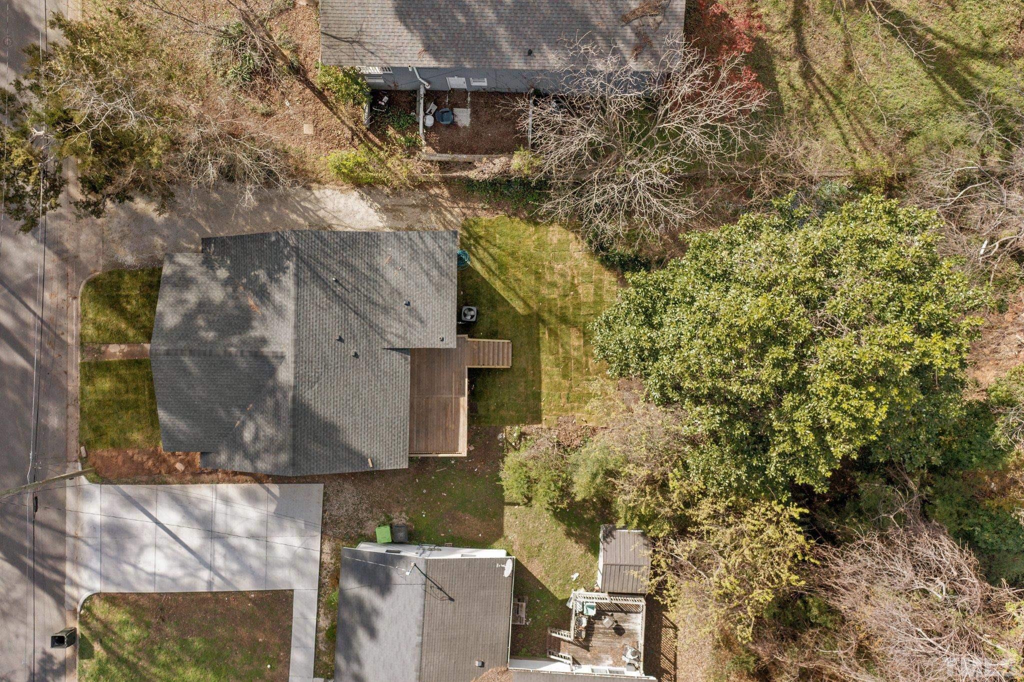 2908 Woods Place Raleigh, NC 27607 - Photo 15 of 38 view of a house with a yard