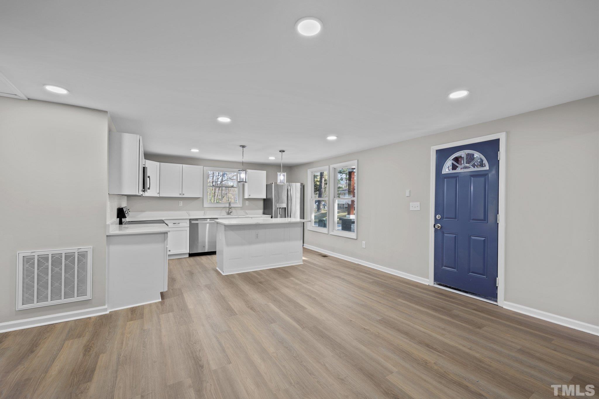 2908 Woods Place Raleigh, NC 27607 - Photo 22 of 38 a view of kitchen with wooden floor and electronic appliances