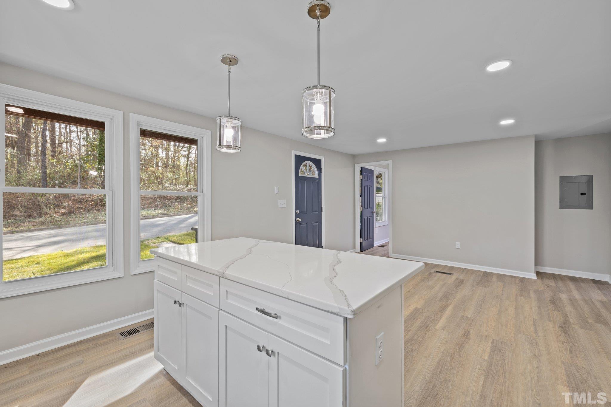 2908 Woods Place Raleigh, NC 27607 - Photo 26 of 38 a view of a kitchen wooden floor and a window