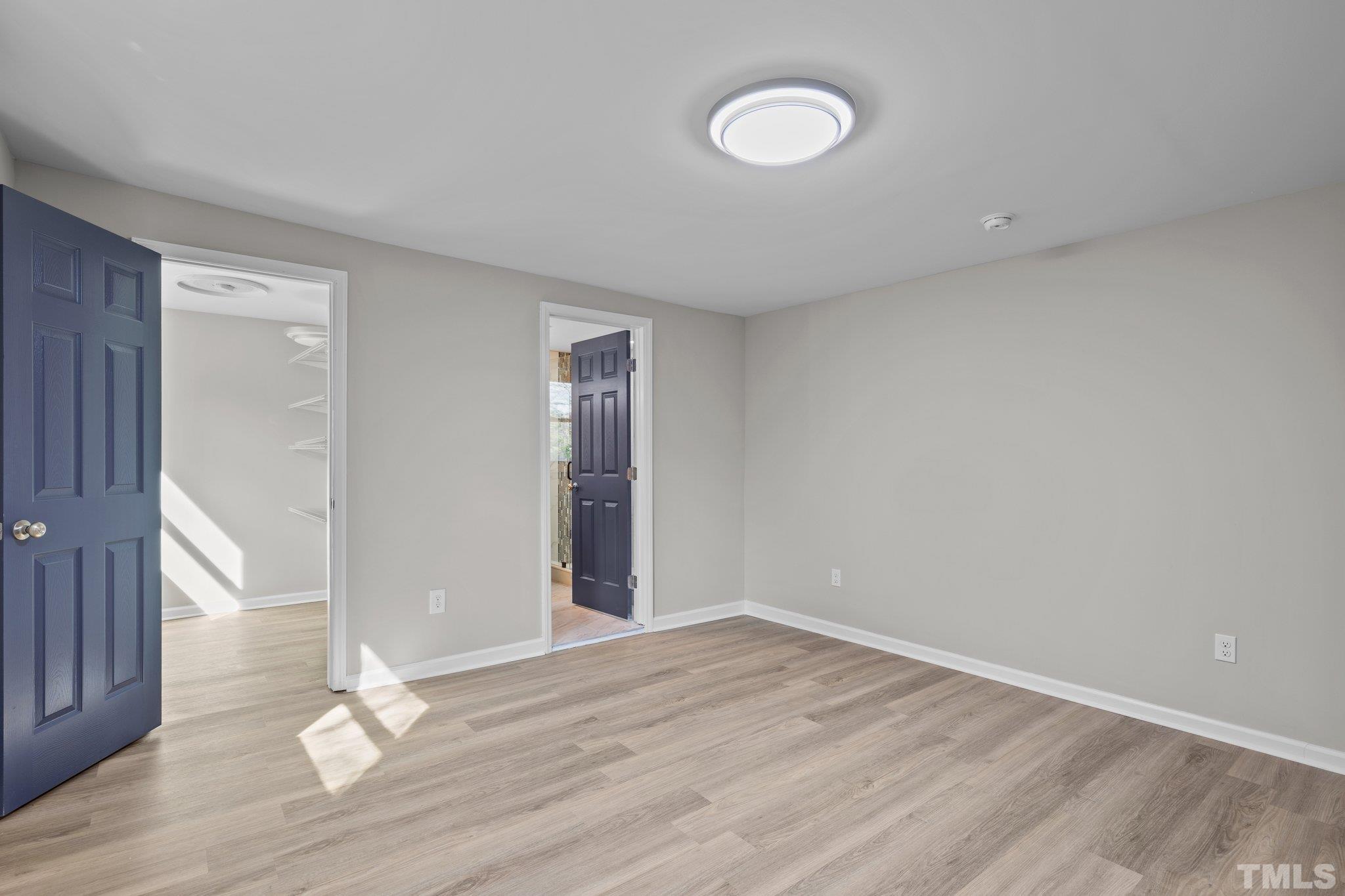 2908 Woods Place Raleigh, NC 27607 - Photo 31 of 38 wooden floor in an empty room with a window