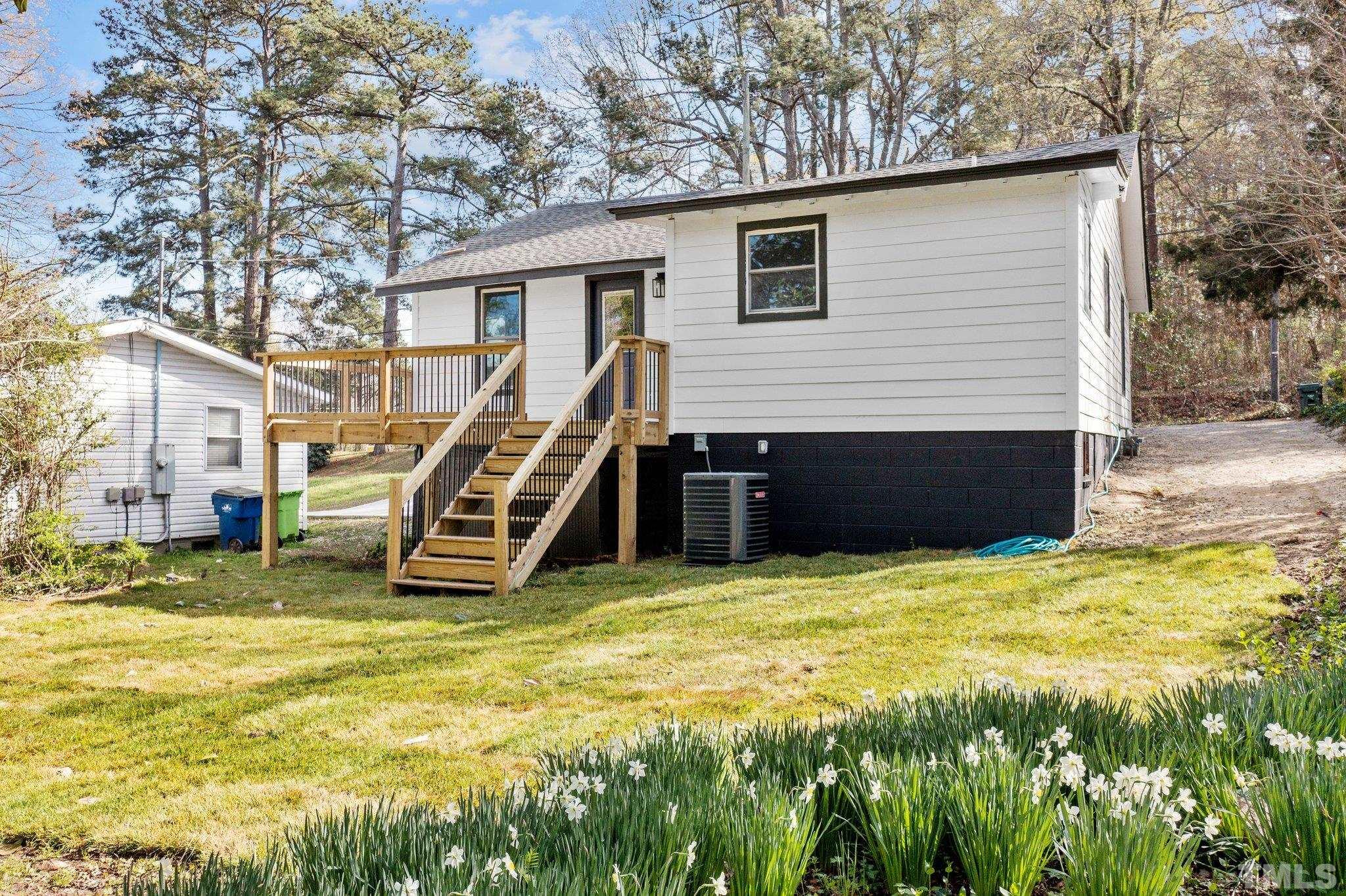 2908 Woods Place Raleigh, NC 27607 - Photo 8 of 38 a view of a house with a slide
