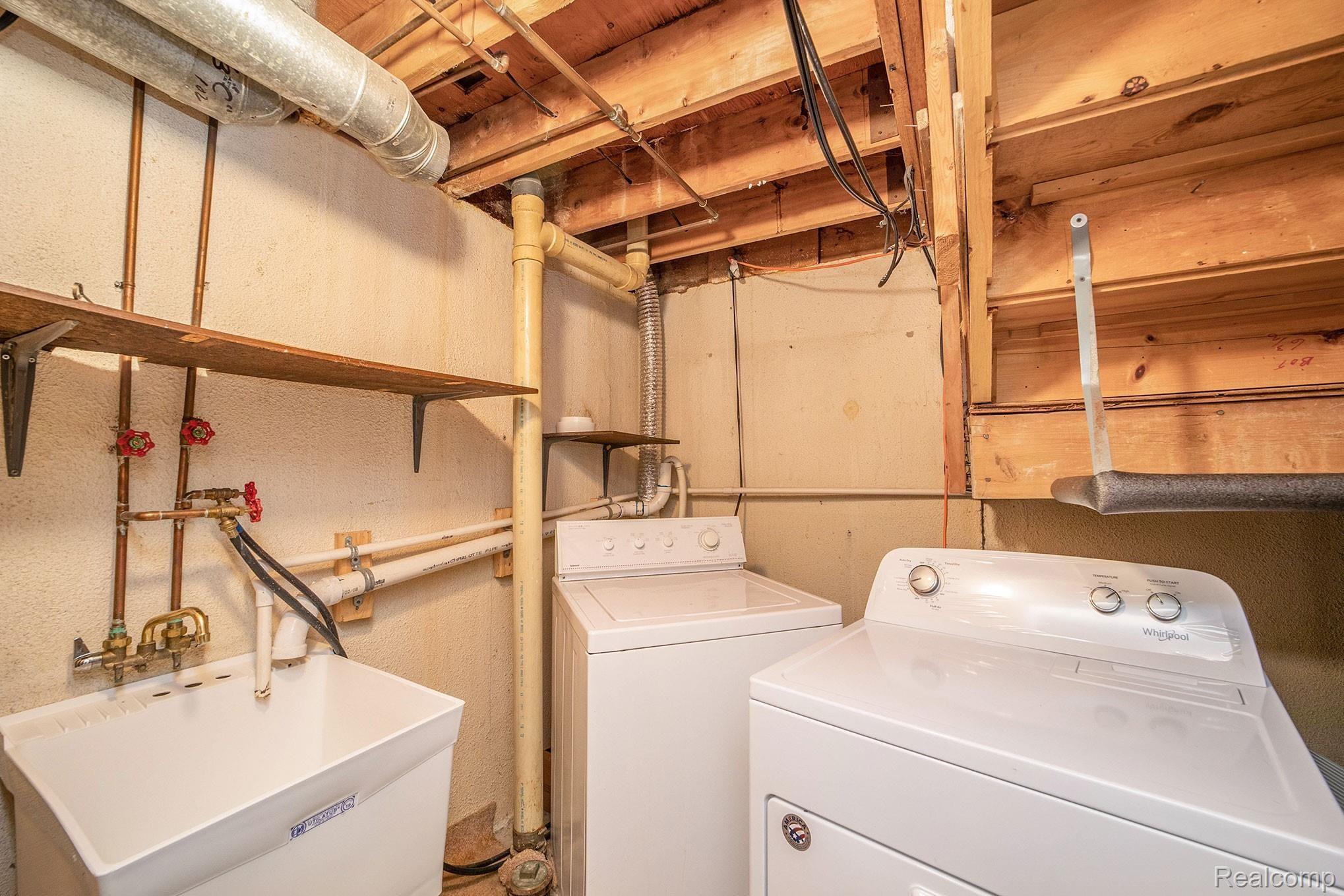 3443 Crooks Road Royal Oak, MI 48073 - Photo 23 of 30 Laundry room with a new dryer & laundry sink.