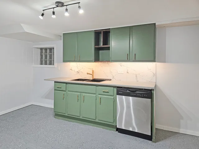 a bathroom with mirror sink and vanity