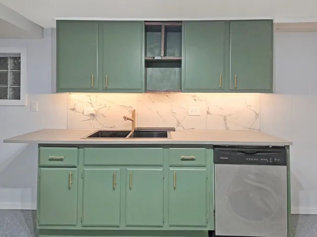 a room with a bed and a television