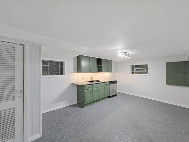 a view of an empty room and a window