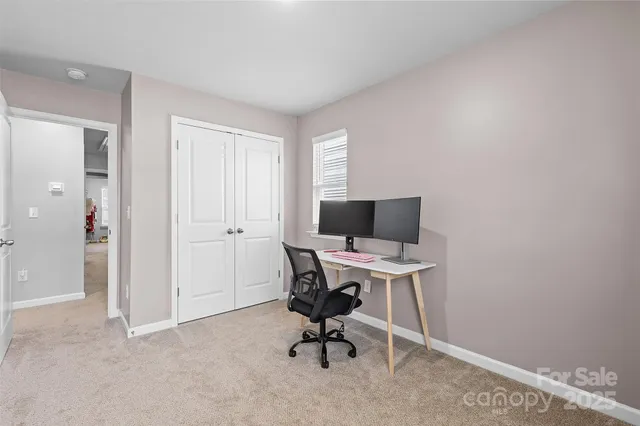 a view of a workspace with furniture