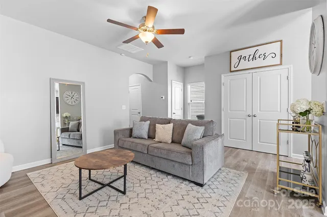 a living room with furniture and a rug