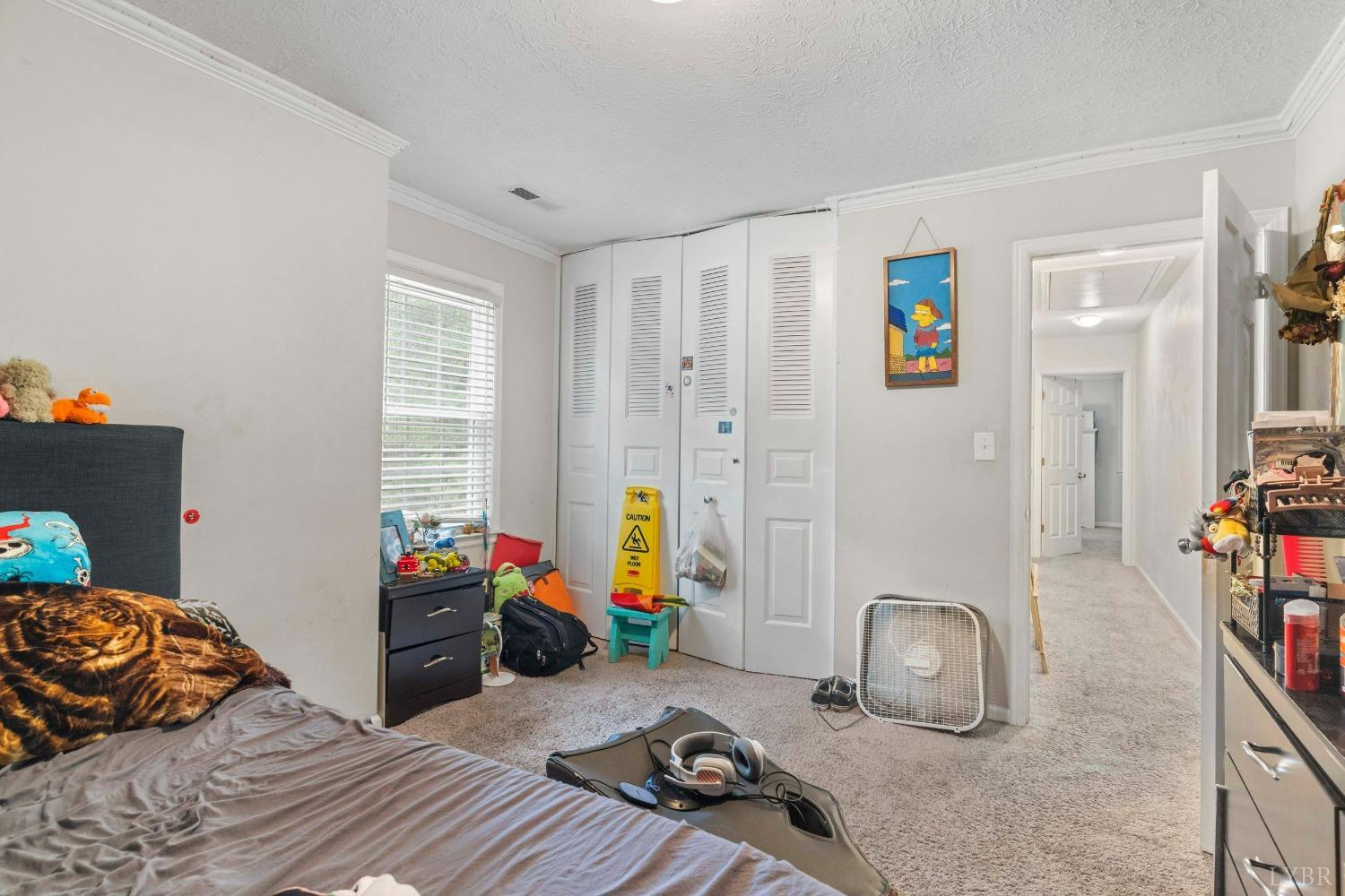 858 Farfields Drive Lynchburg, VA 24502 - Photo 16 of 61 a bedroom with furniture and a book shelf