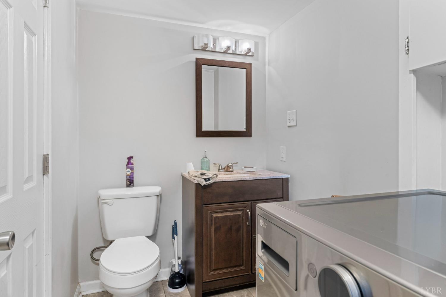 858 Farfields Drive Lynchburg, VA 24502 - Photo 30 of 61 a bathroom with a toilet sink vanity granite and mirror
