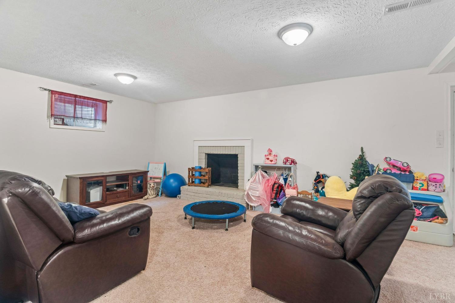 858 Farfields Drive Lynchburg, VA 24502 - Photo 31 of 61 a living room with furniture and a fireplace