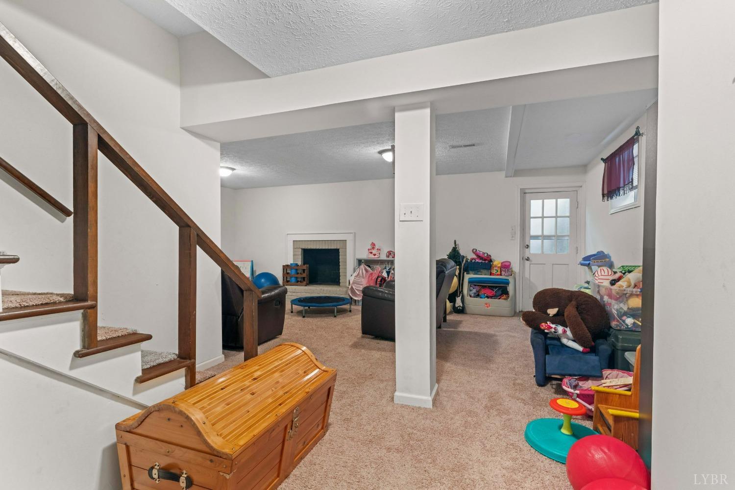 858 Farfields Drive Lynchburg, VA 24502 - Photo 34 of 61 a living room with furniture and a flat screen tv