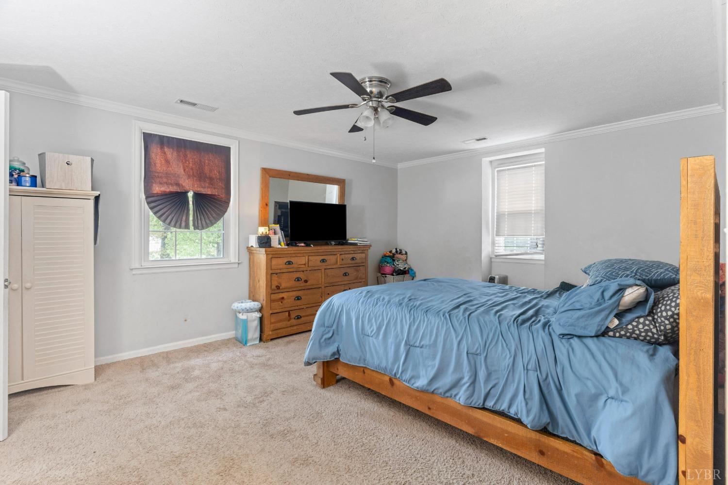 858 Farfields Drive Lynchburg, VA 24502 - Photo 5 of 61 a bedroom with a bed and a flat screen tv
