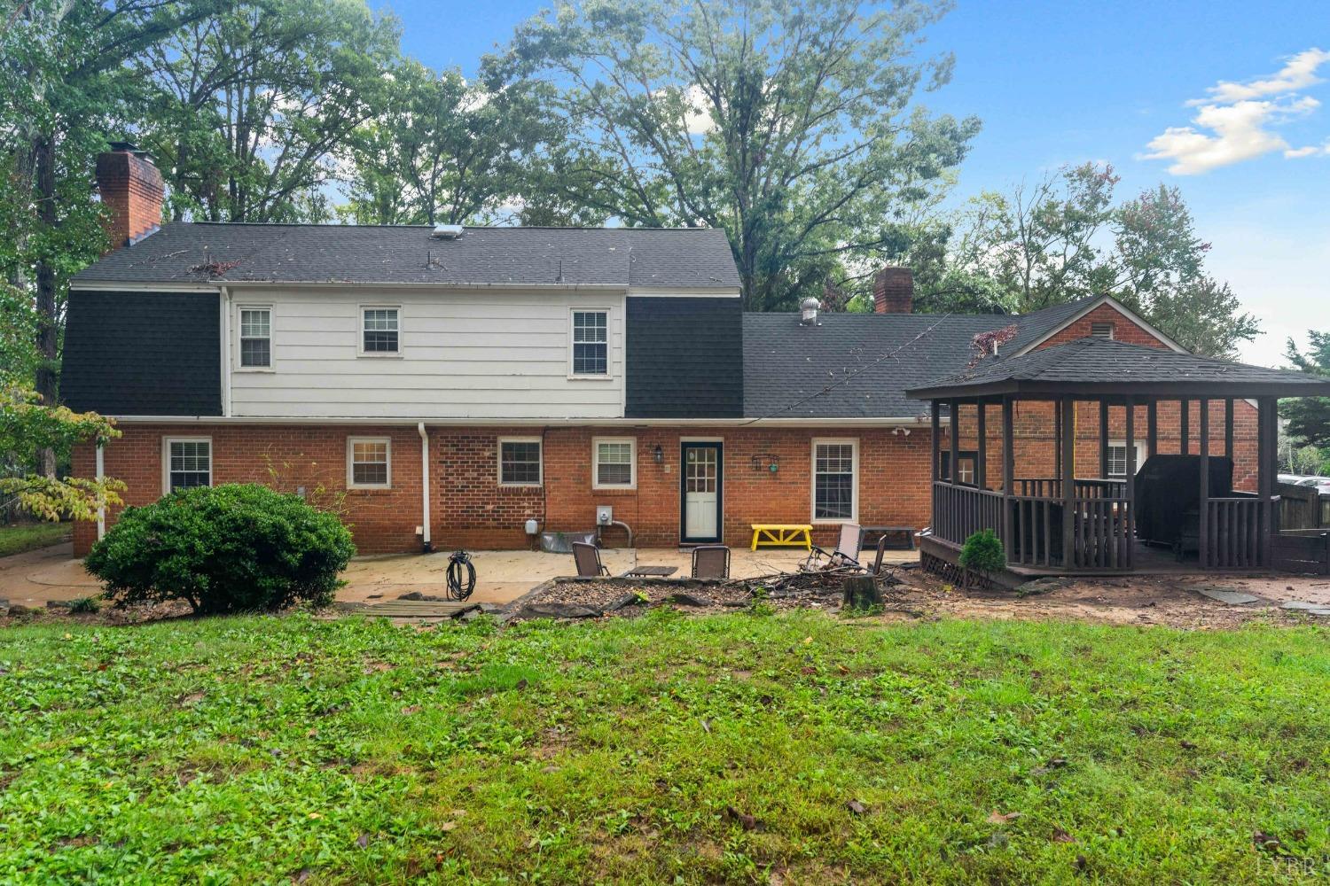 858 Farfields Drive Lynchburg, VA 24502 - Photo 51 of 61 a front view of a house with a yard patio and fire pit