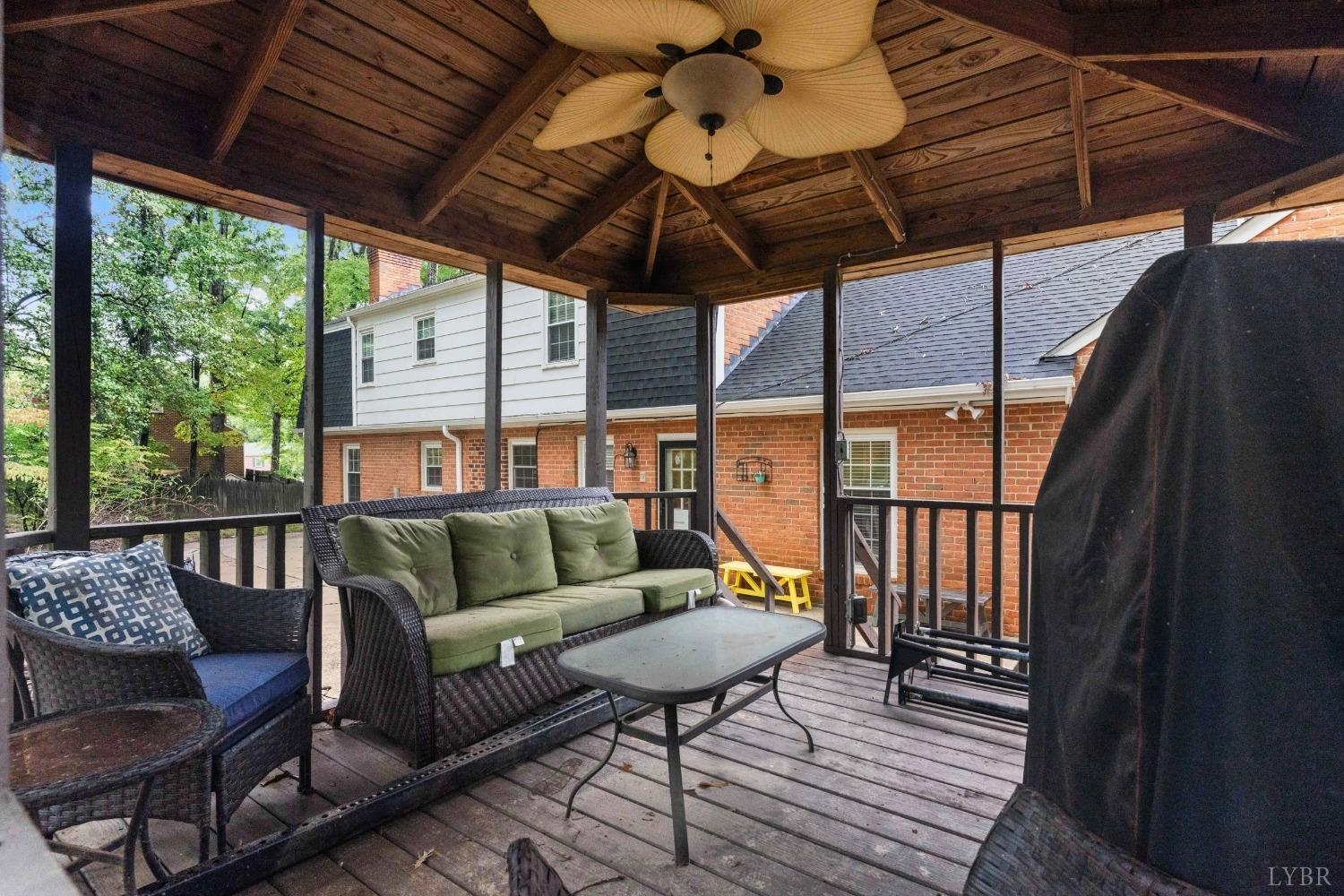 858 Farfields Drive Lynchburg, VA 24502 - Photo 58 of 61 a balcony with furniture and a umbrella