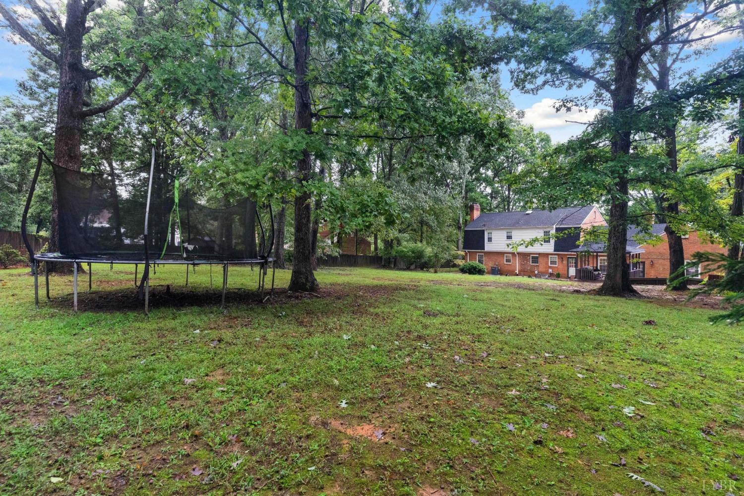 858 Farfields Drive Lynchburg, VA 24502 - Photo 60 of 61 a view of a yard with a house and large trees