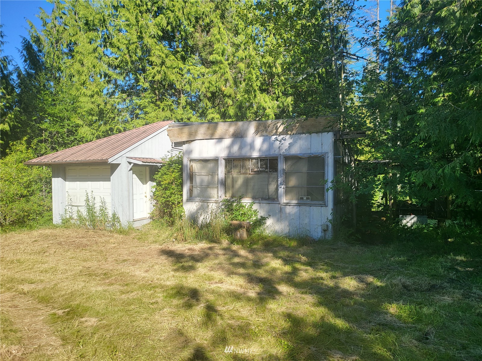 377 South Eldridge Road Sequim, WA 98382 - Photo 13 of 20 a backyard of a house with yard and outdoor seating