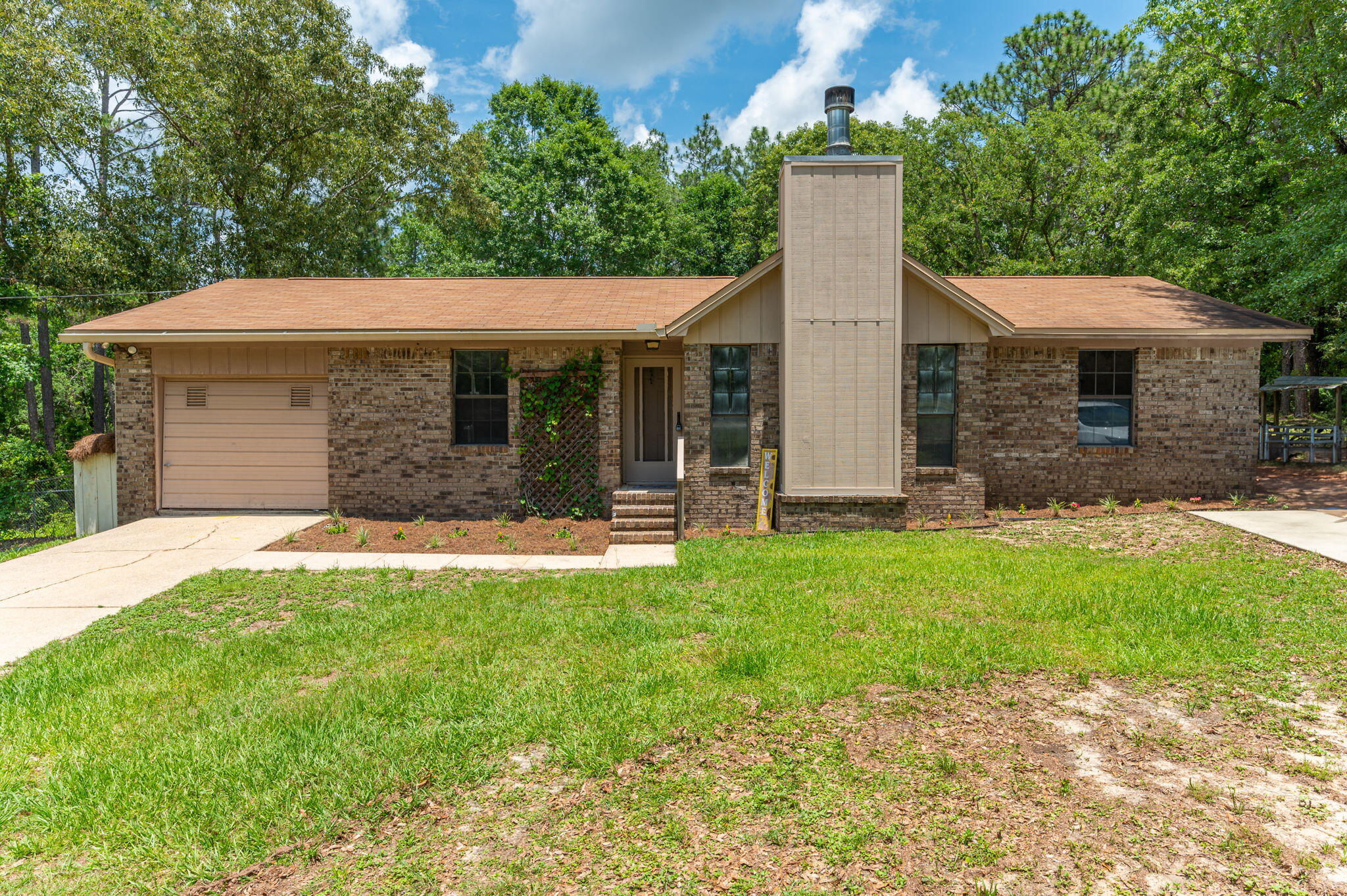 6141 Bud Moulton Road Crestview, FL 32536 - Photo 1 of 34 a front view of house with yard and green space