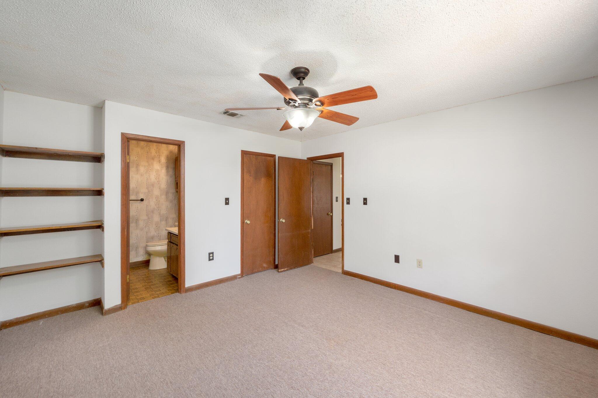 6141 Bud Moulton Road Crestview, FL 32536 - Photo 16 of 34 an empty room with closet and a ceiling fan
