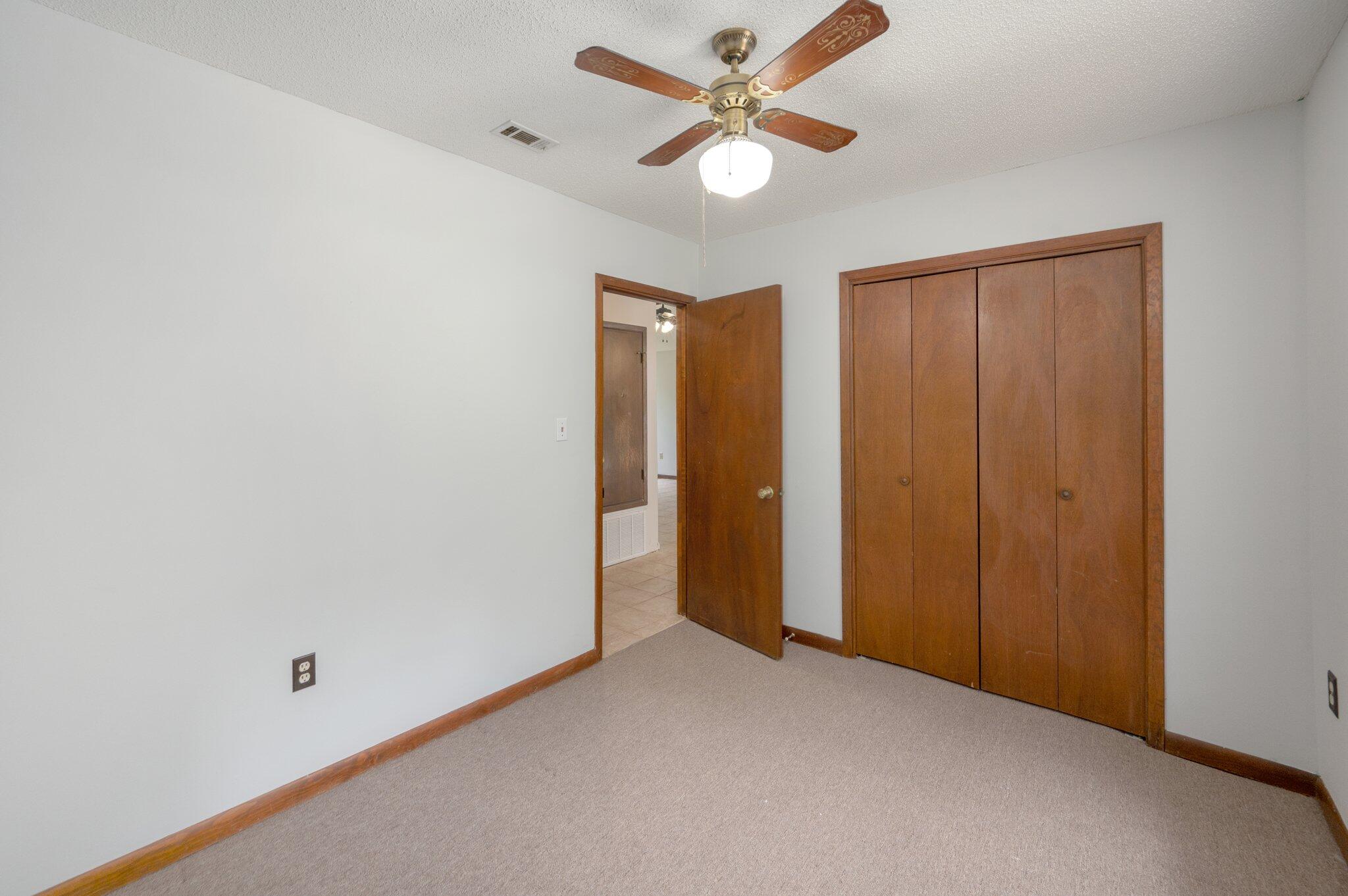 6141 Bud Moulton Road Crestview, FL 32536 - Photo 21 of 34 an empty room with closet and a ceiling fan