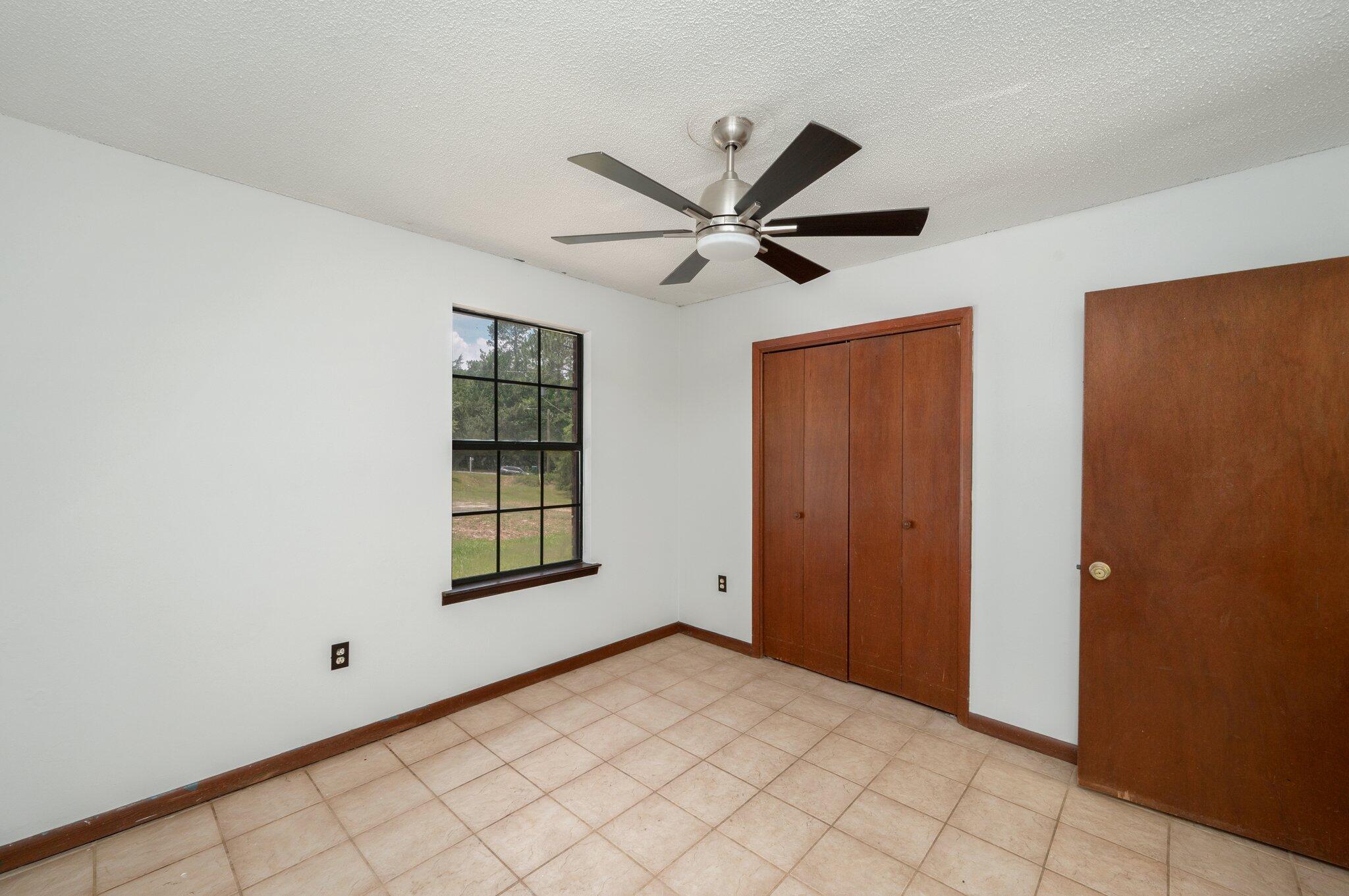 6141 Bud Moulton Road Crestview, FL 32536 - Photo 23 of 34 a view of an empty room and window