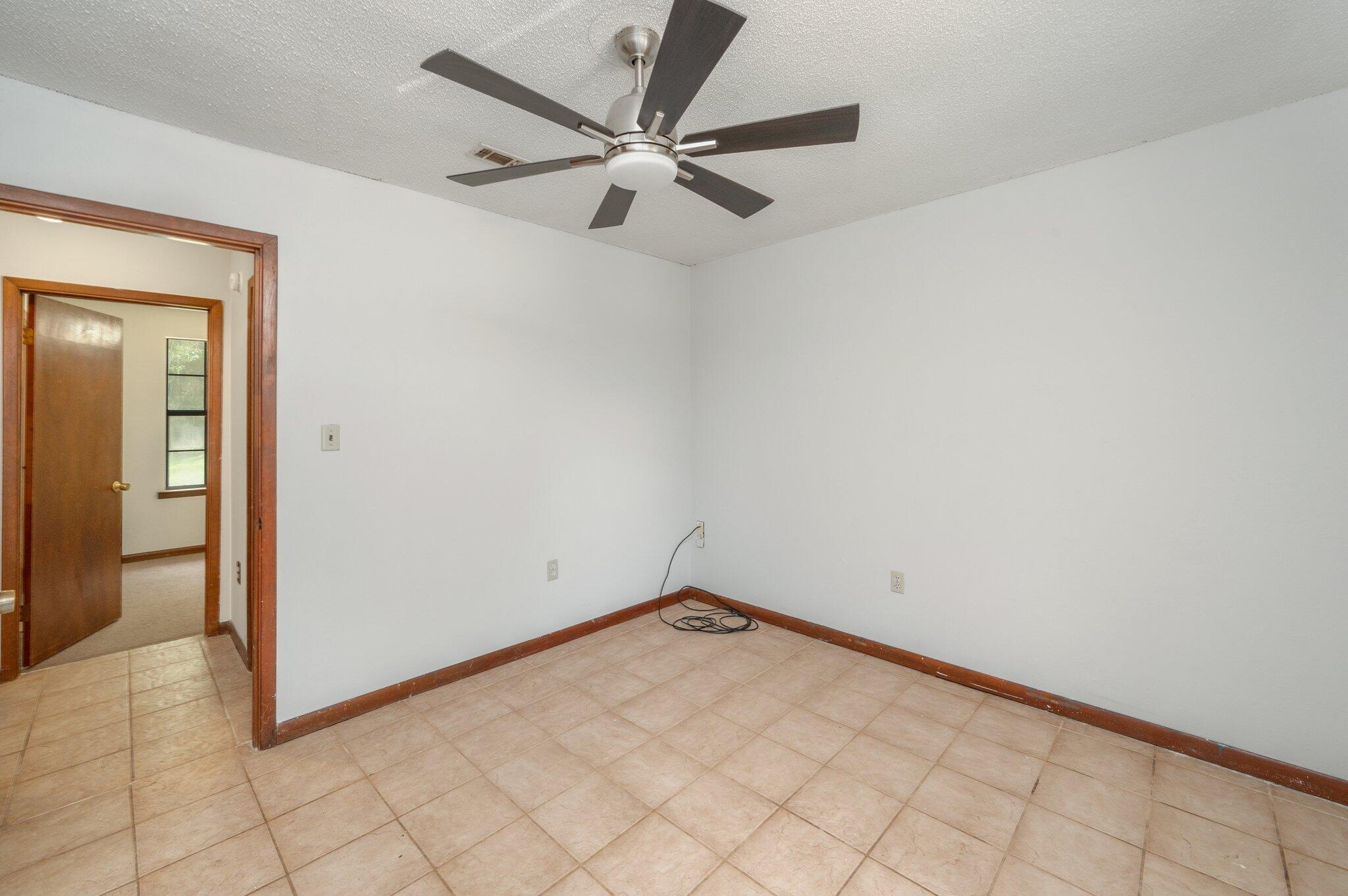 6141 Bud Moulton Road Crestview, FL 32536 - Photo 24 of 34 a view of a room with a fan