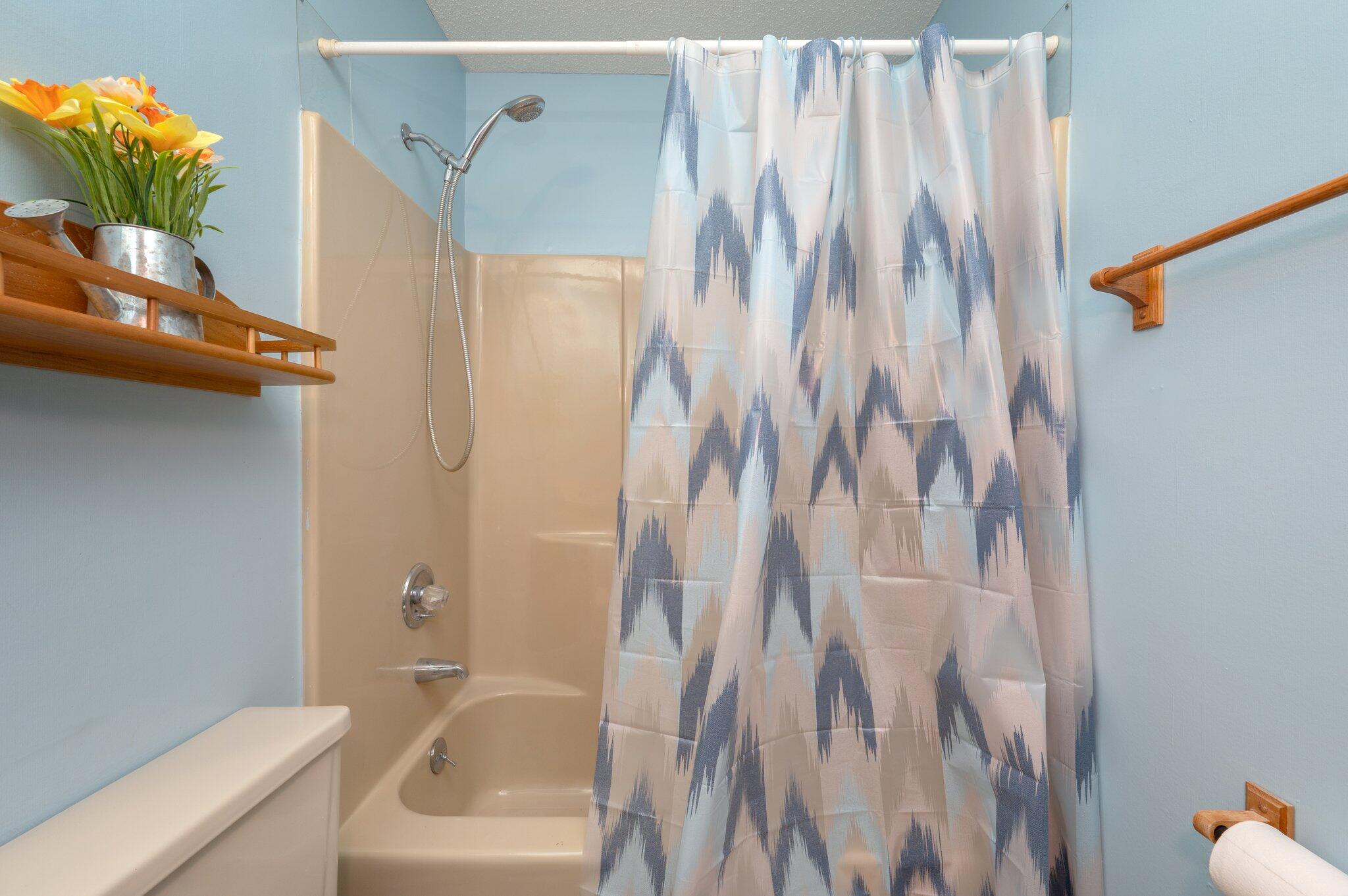 6141 Bud Moulton Road Crestview, FL 32536 - Photo 26 of 34 a bathroom with a shower curtain and a sink