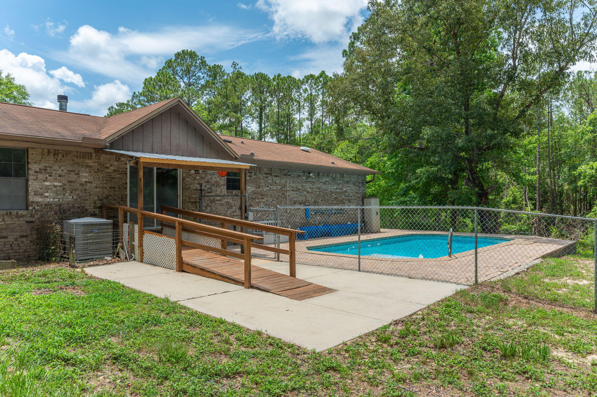 6141 Bud Moulton Road Crestview, FL 32536 - Photo 28 of 34 a view of house with deck and yard