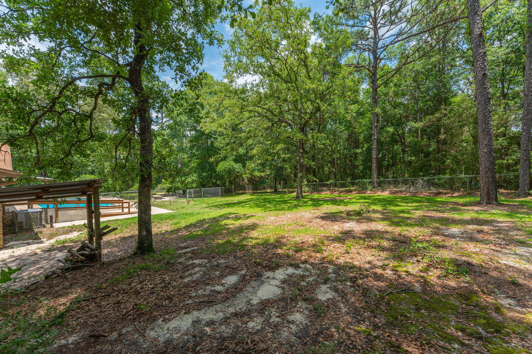 6141 Bud Moulton Road Crestview, FL 32536 - Photo 32 of 34 a view of a park with large trees