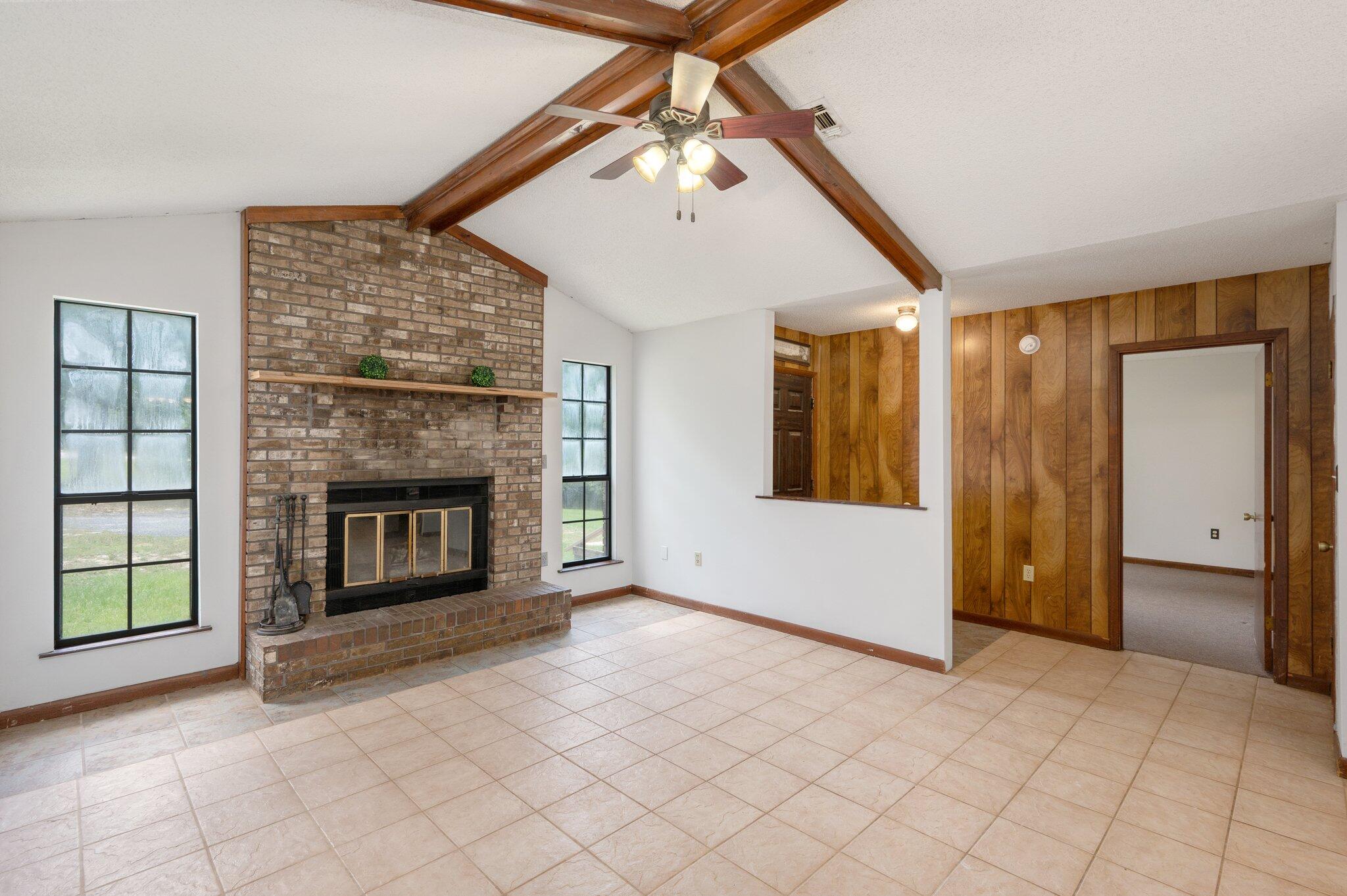 6141 Bud Moulton Road Crestview, FL 32536 - Photo 6 of 34 a view of a livingroom with a fireplace cabinet and a fireplace