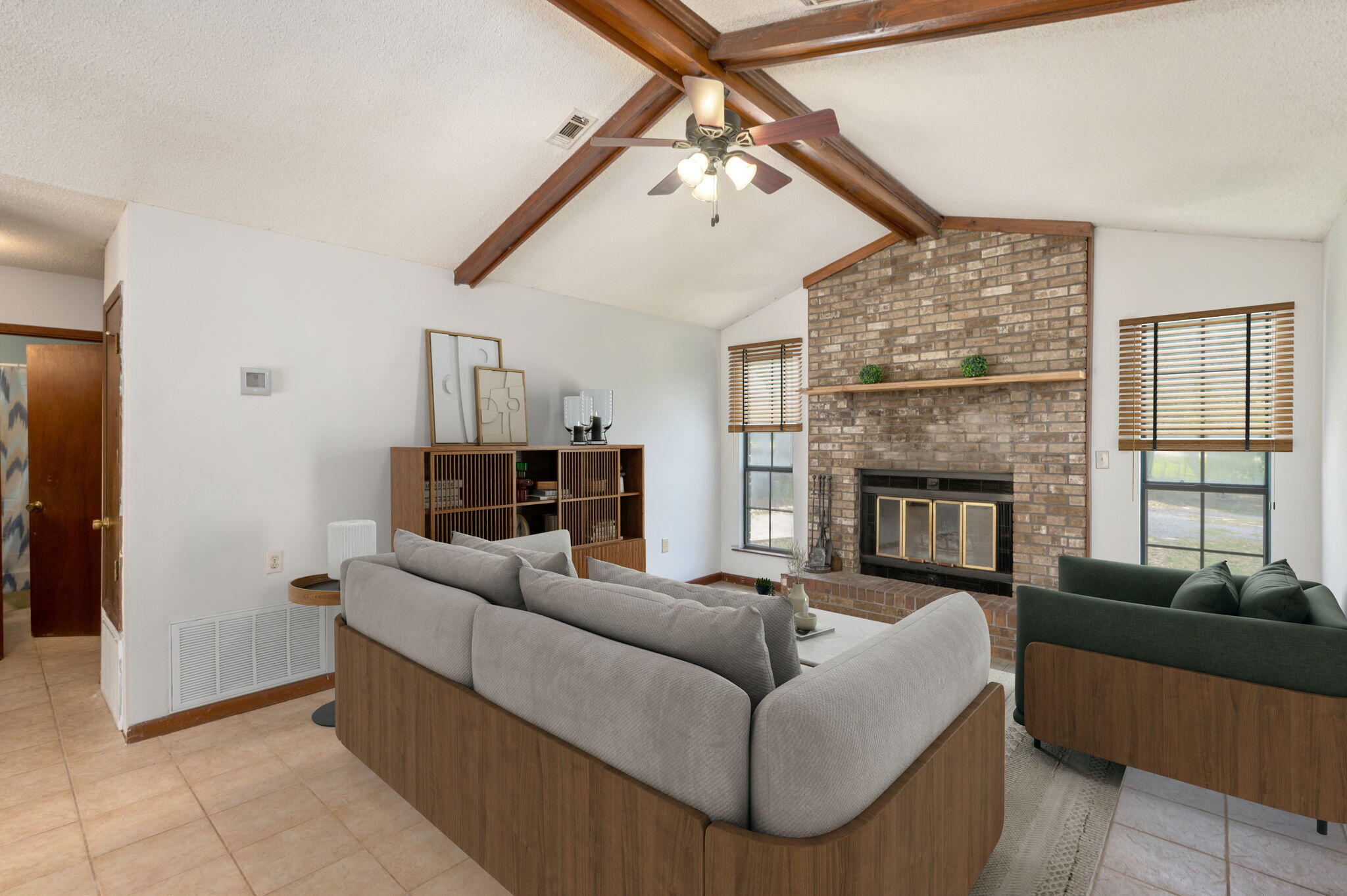 6141 Bud Moulton Road Crestview, FL 32536 - Photo 8 of 34 a living room with furniture and a fireplace